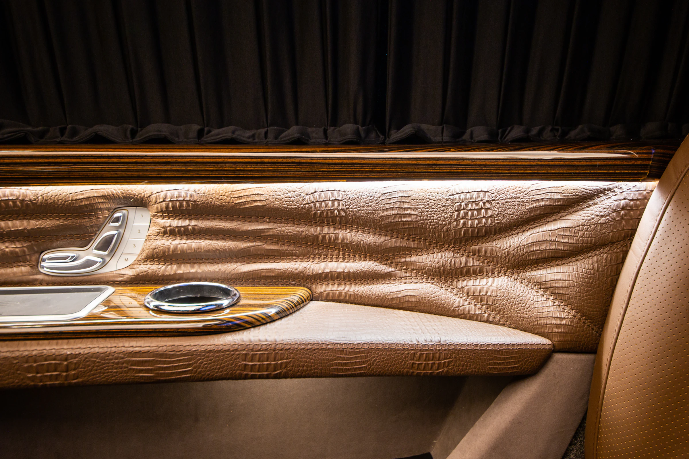 Genuine crocodile leather, timber trim and seat-control craftsmanship in an Ertex VIP vehicle