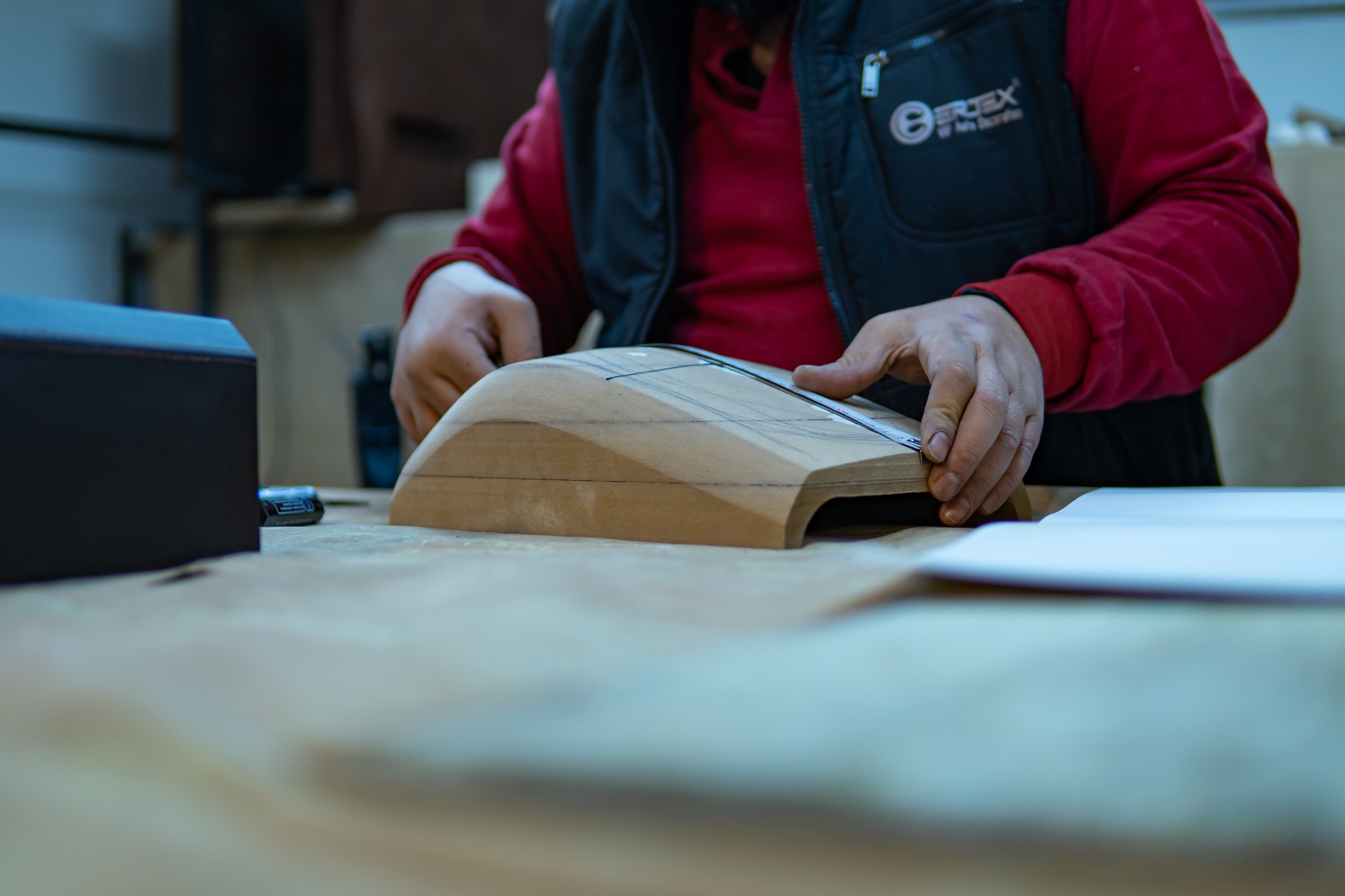 Ertex artisan shaping a bespoke interior component