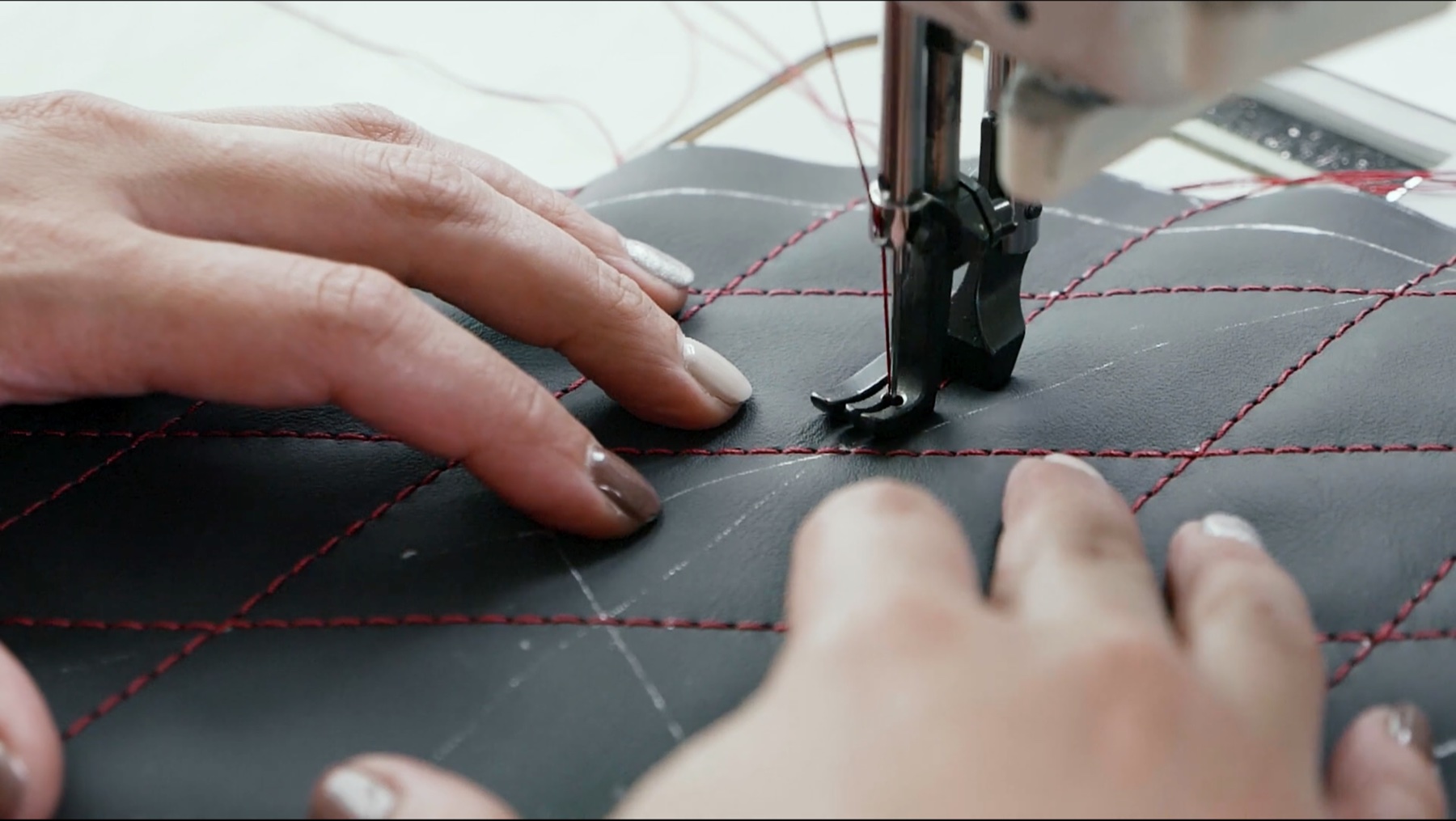 Ertex artisan sewing bespoke leather upholstery